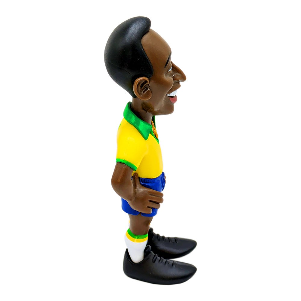 Football figurine in the Minix Pelé Brazil Home Kit, with a yellow shirt, green collar, blue shorts and black boots.