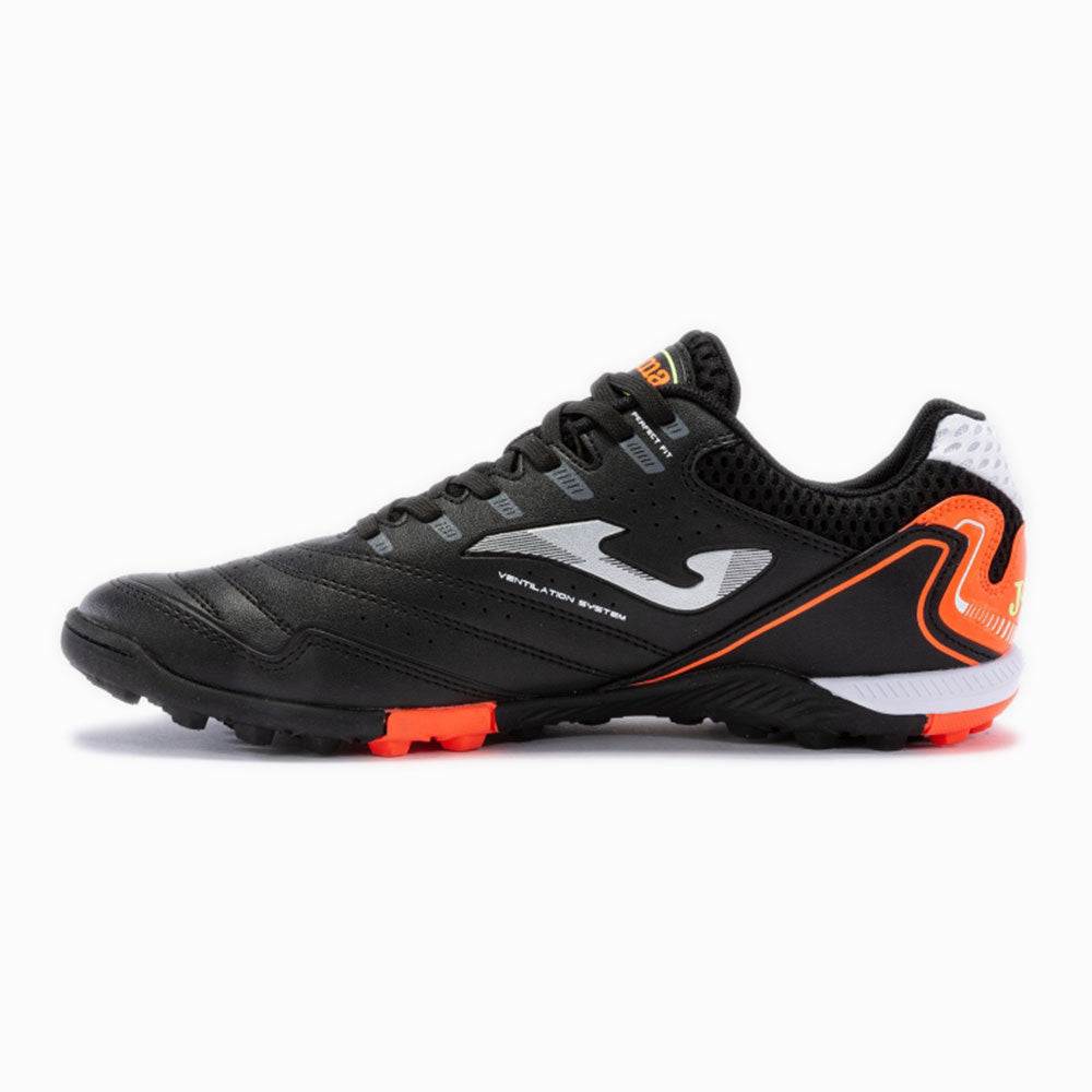 Joma Maxima Adult Turf Soccer Shoes in black with orange accents, featuring superior traction and lightweight design.