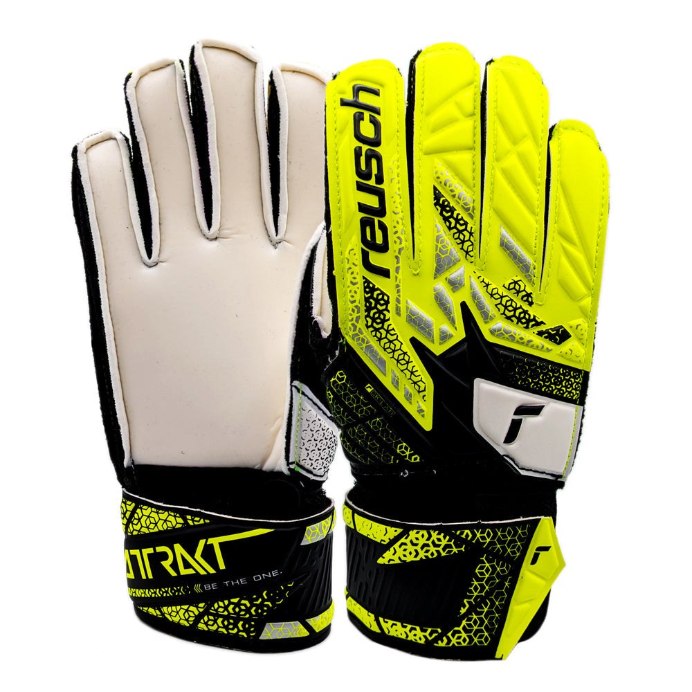 Reusch Attrakt Junior Goalkeeper Gloves in yellow and black with synthetic latex palm for artificial grass and hard surfaces.