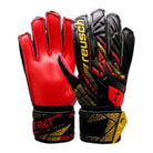 Reusch-Attrakt Solid Junior Goalkeeper Gloves with red palm, black and gold backhand, full strap closure, and breathable materials for durability and comfort.