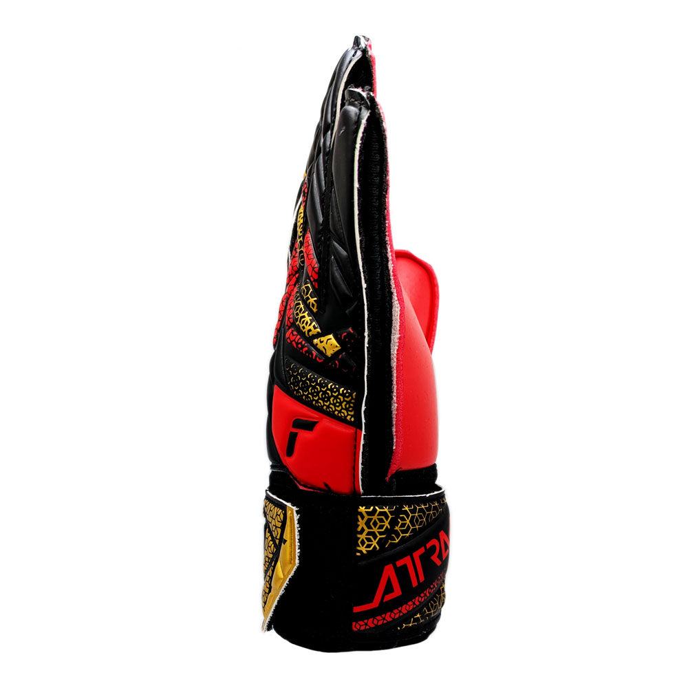 Reusch Attrakt Solid Junior Goalkeeper Gloves side view with red, black, and gold design and wrist strap closure