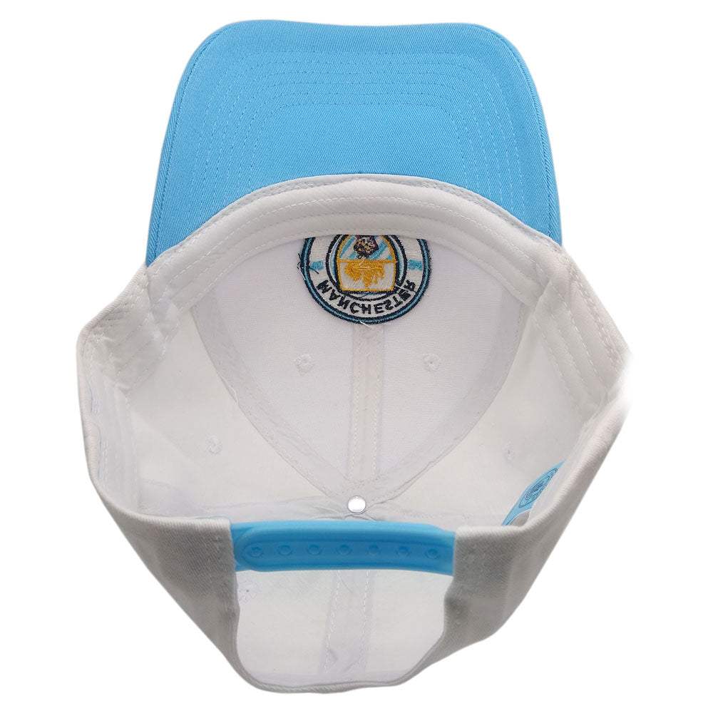 Manchester City Two-Tone Adjustable Cap in sky blue and white, with gray side panels, snapback strap and embroidered crest.