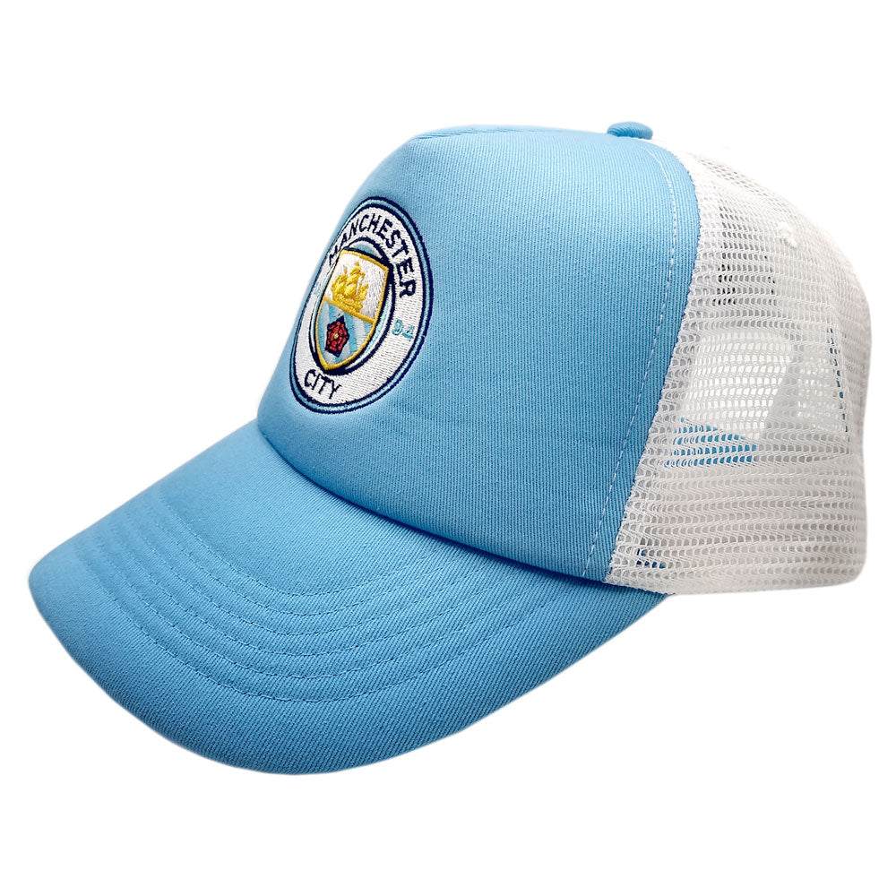Fan Ink Officially Licensed trucker hat with light blue front, white mesh back, Manchester City embroidered crest, and adjustable snapback closure
