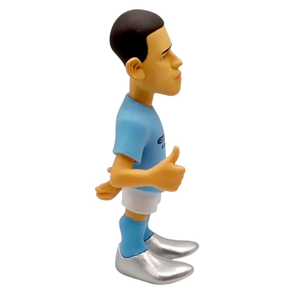Football figurine in a sky-blue shirt, white shorts and silver boots; Minix Phil Foden Manchester City collectible with molded dark hair.