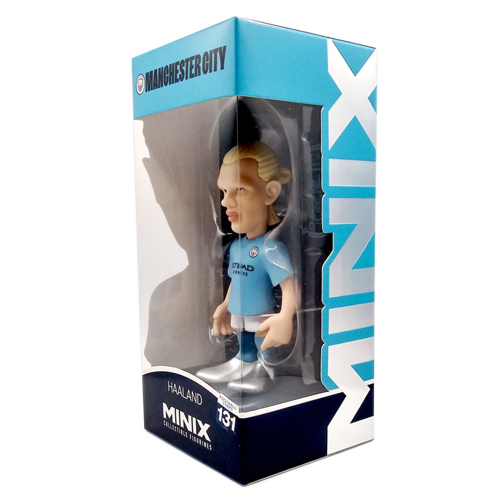 Football figurine in a light blue Manchester City kit, boxed in a blue MINIX display package; Minix Erling Haaland Manchester City collectible.