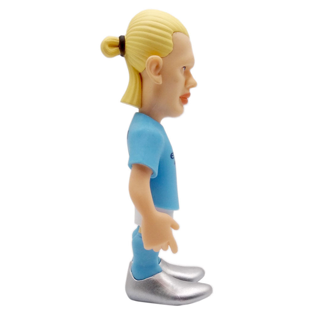 Minix Erling Haaland Manchester City figurine with a light blue football kit, blond hair tied back and silver boots.