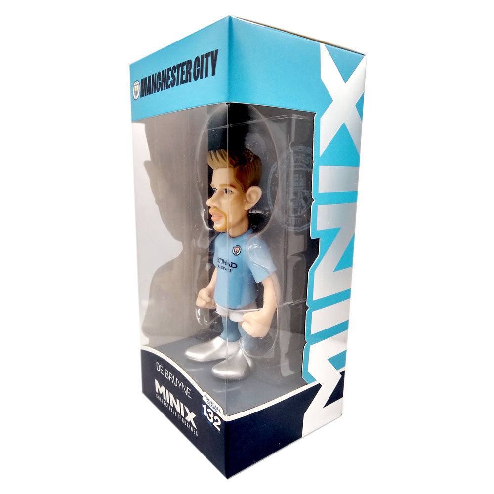 Minix Kevin De Bruyne Manchester City figurine in a sky-blue football kit, displayed in a clear window box with bold branding.