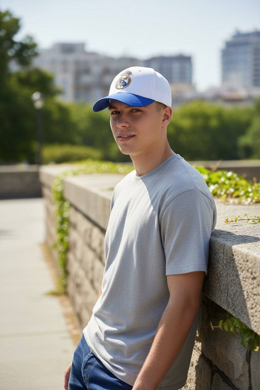 Man wearing Fan Ink officially licensed 2-tone adjustable soccer hat with Real Madrid logo outdoors