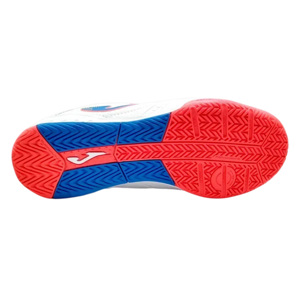 Joma Dribling indoor soccer shoe outsole in red and blue rubber with textured traction patterns and white Joma logo