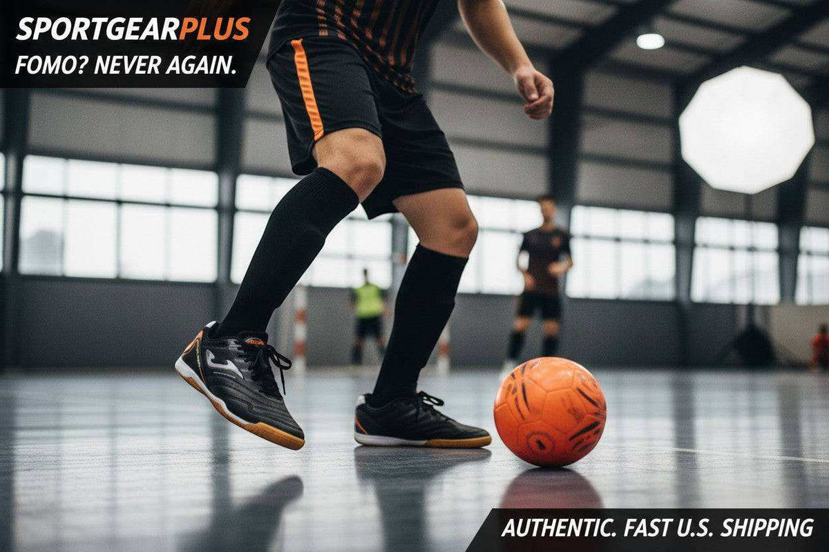 Joma Maxima indoor soccer shoes in black synthetic material with orange accents and a flat rubber court outsole
