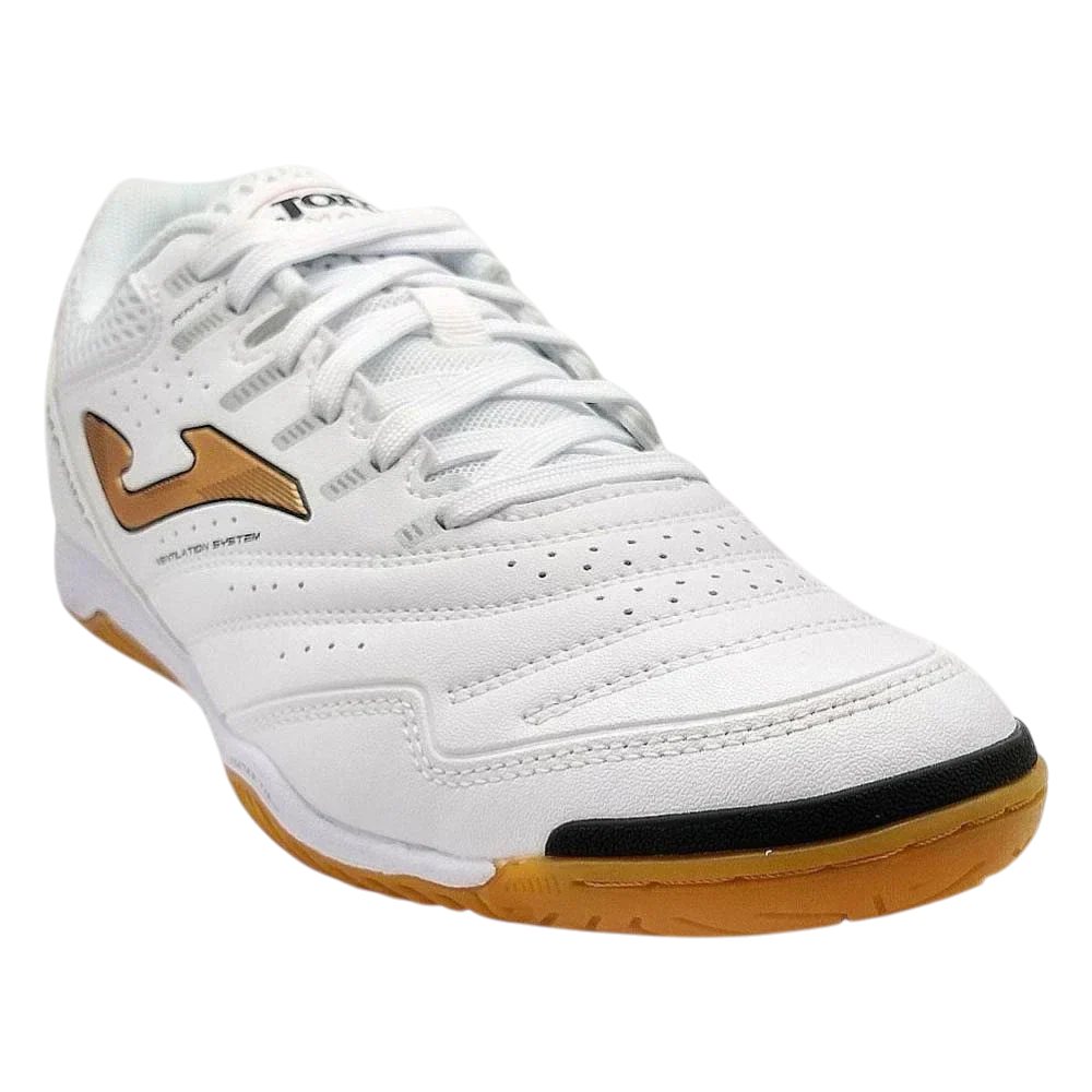 Joma Maxima indoor soccer shoe in white synthetic material with perforated panels, a gold side logo and gum rubber sole