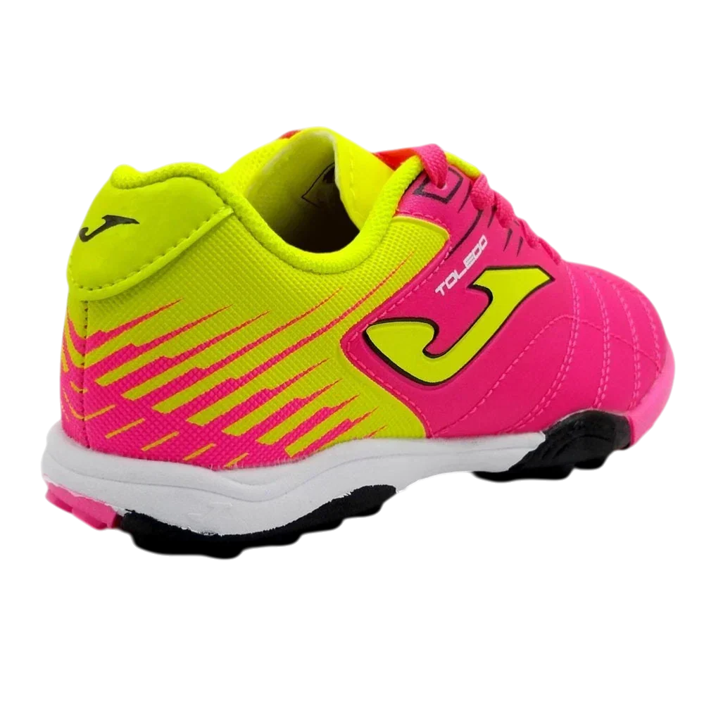 Joma Toledo turf soccer shoe in neon yellow and hot pink synthetic material, with striped accents and rubber studs