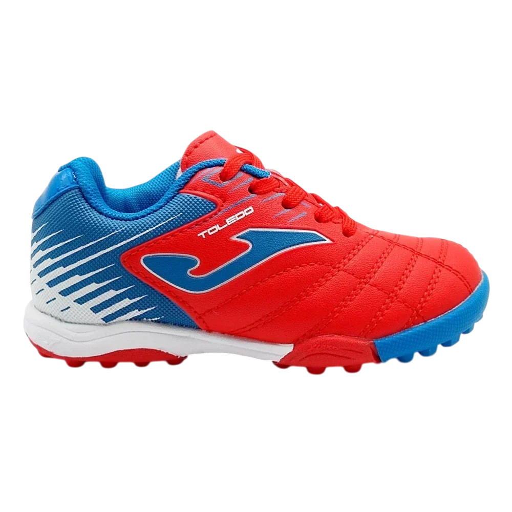 Joma Toledo turf soccer shoe in red and blue synthetic material, with white accents and rubber turf studs