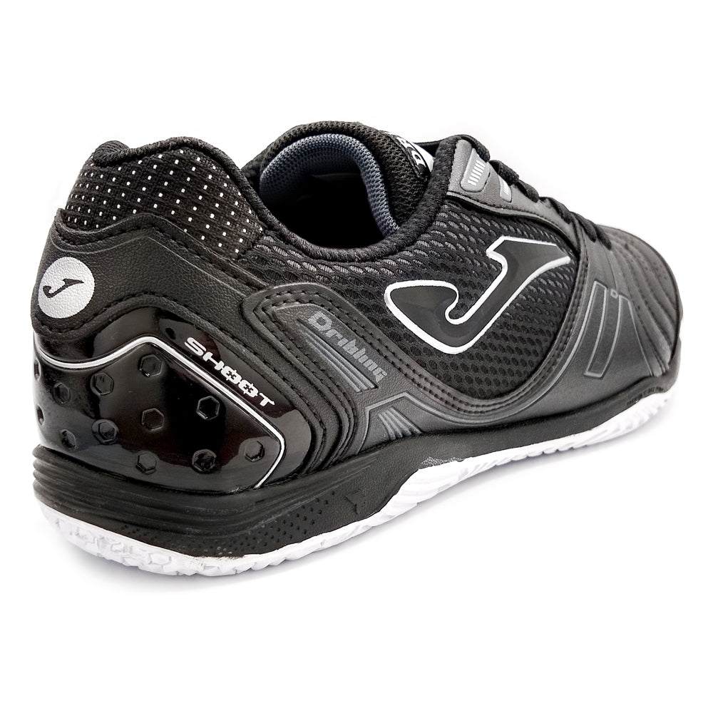 Joma Dribling Indoor Soccer Shoes with black and white design, sleek and lightweight for indoor play.