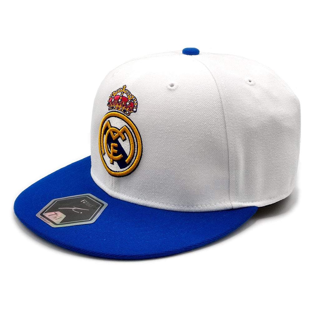 White and blue fitted hat with embroidered logo, showcasing team pride.