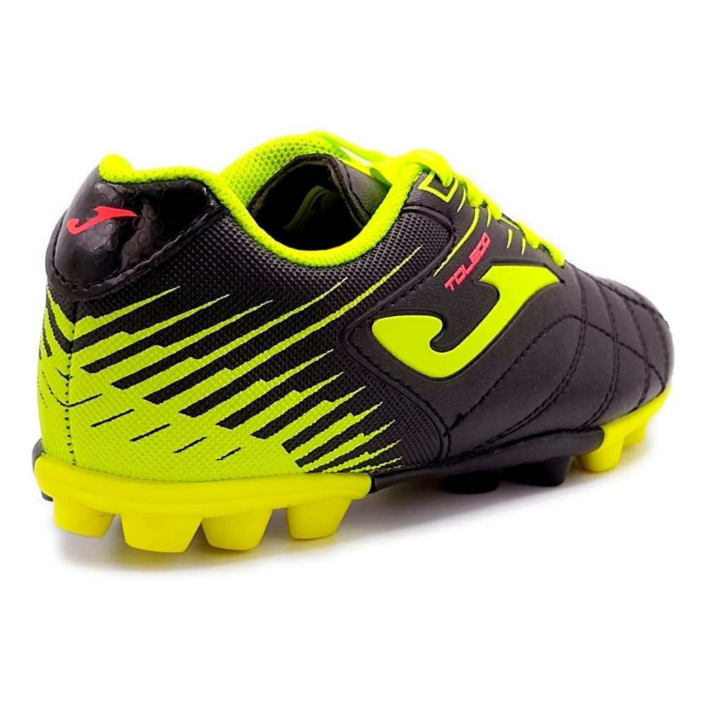 Junior firm ground soccer cleats by Joma in black with lightweight synthetic upper and durable rubber outsole for young players