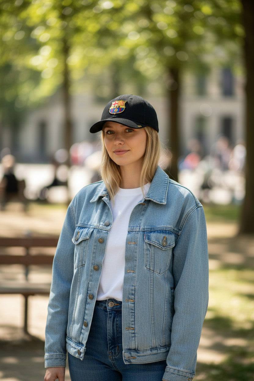 Woman wearing Fan Ink officially licensed FC Barcelona adjustable snapback hat in outdoor park setting