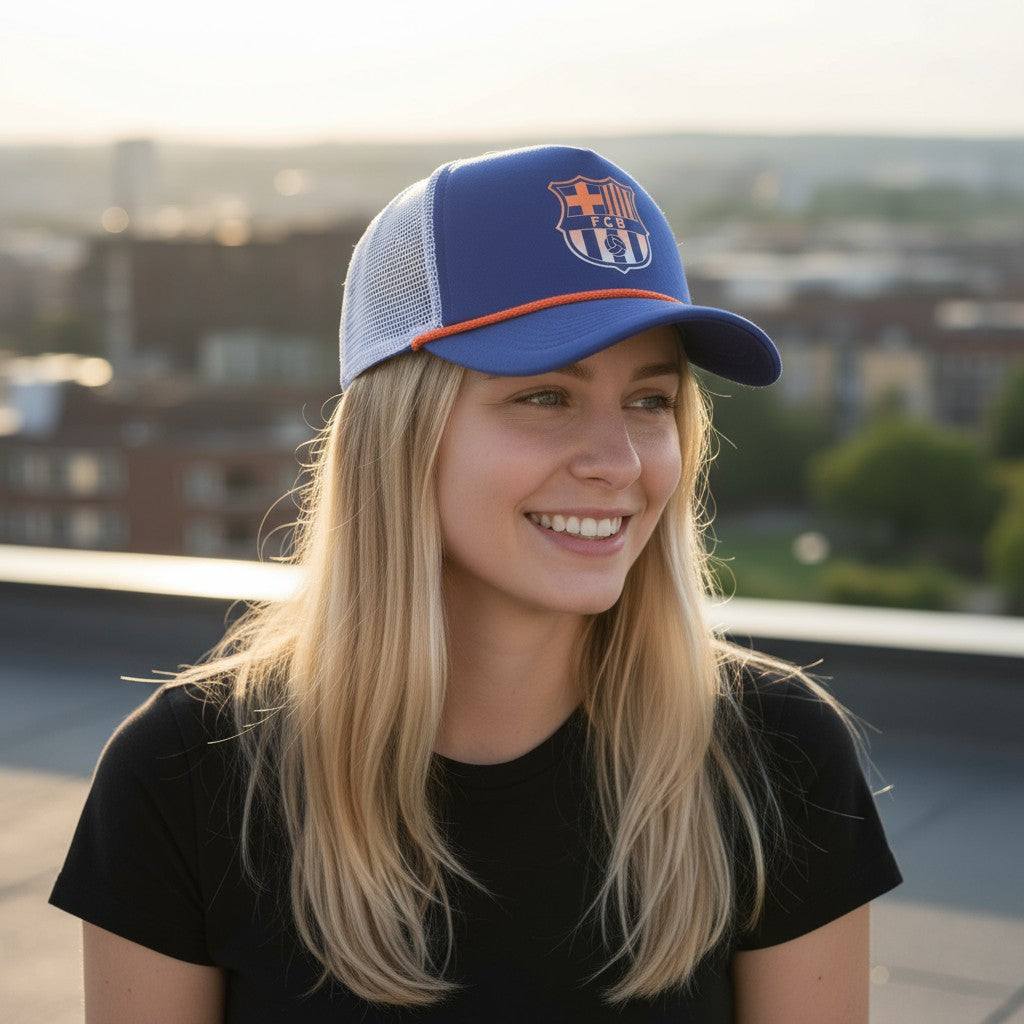 Woman wearing blue and white FC Barcelona Serve Trucker Hat with mesh back and curved peak outdoors