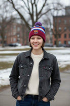 Young woman wearing Fan Ink officially licensed Barcelona soccer knit cap winter hat with club crest outdoors in cold weather
