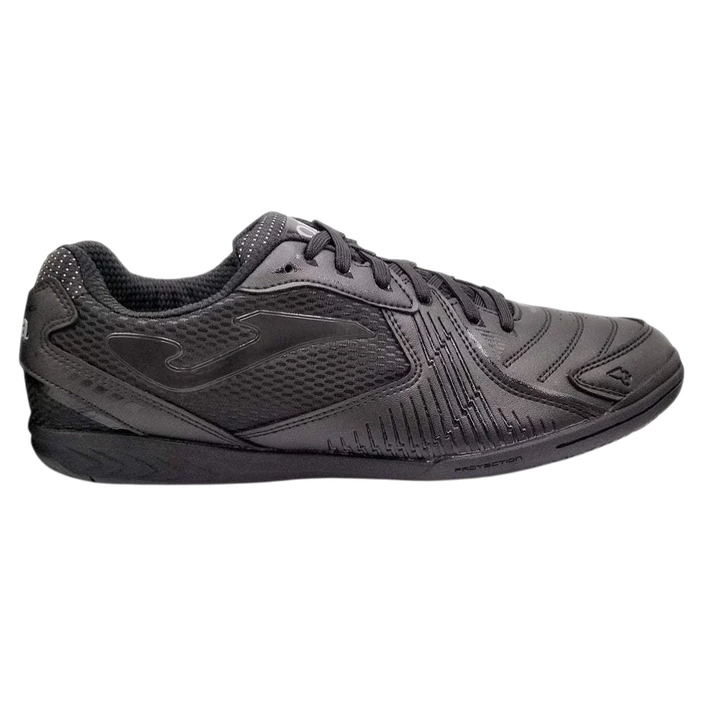 Indoor soccer shoe, Joma Dribling in charcoal black synthetic material with textured panels, lace-up design and flat rubber sole.