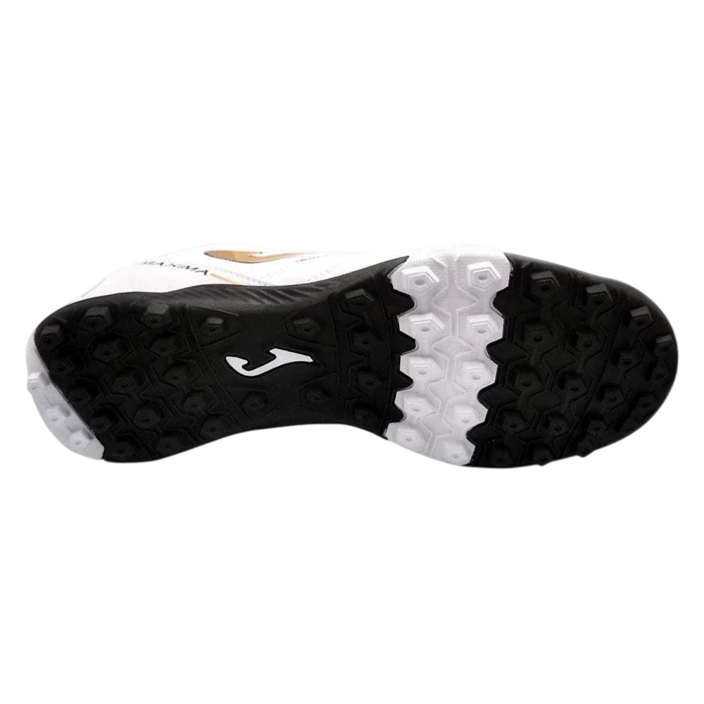Joma Maxima turf soccer shoe with a black and white rubber outsole and multi-directional studs