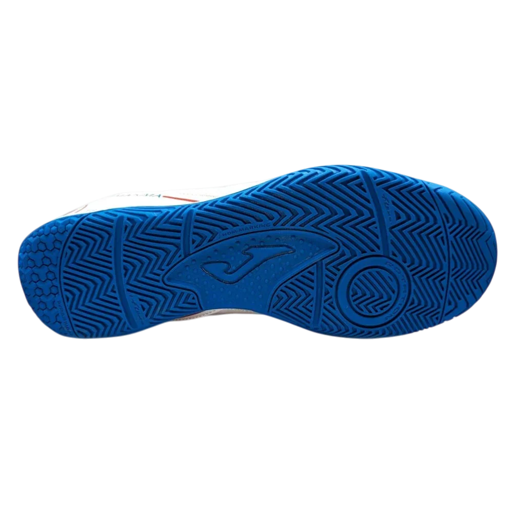 Joma Maxima indoor soccer shoe with a bright blue rubber outsole, featuring deep geometric tread and circular grip details