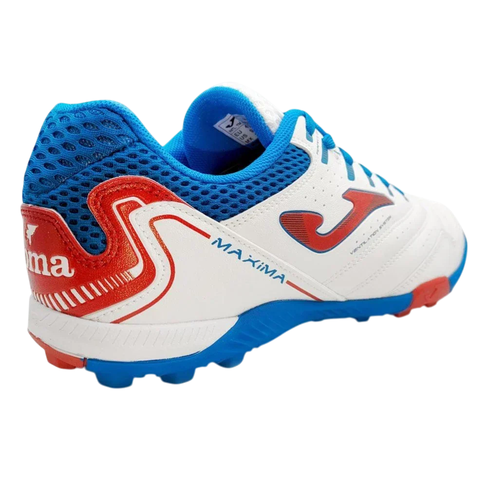 Joma Maxima turf soccer shoe in white synthetic material with blue mesh panels, red accents and rubber turf studs