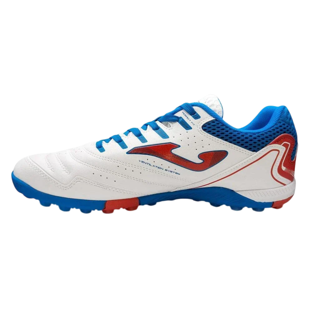 Joma Maxima turf soccer shoe with a white synthetic upper, blue mesh panels and laces, red accents, and rubber studs