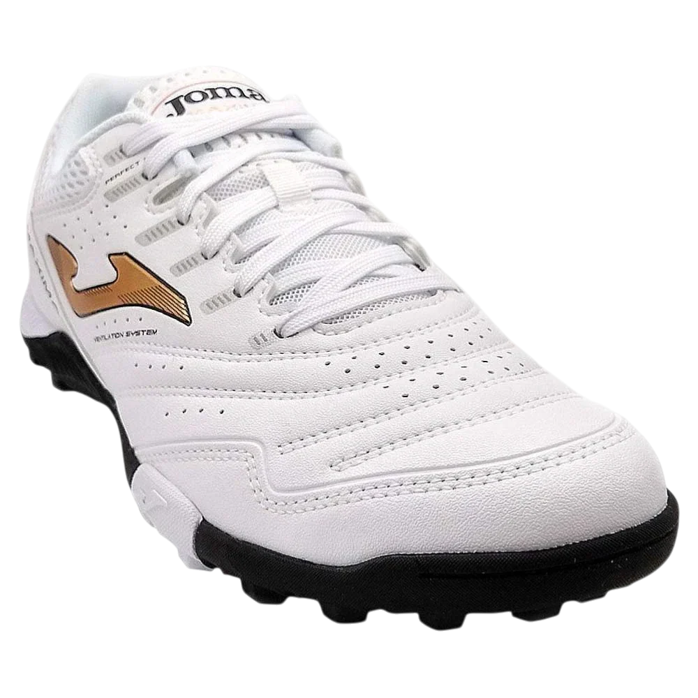 Joma Maxima turf soccer shoe in white synthetic material, with perforated panels, gold side logo and black rubber outsole