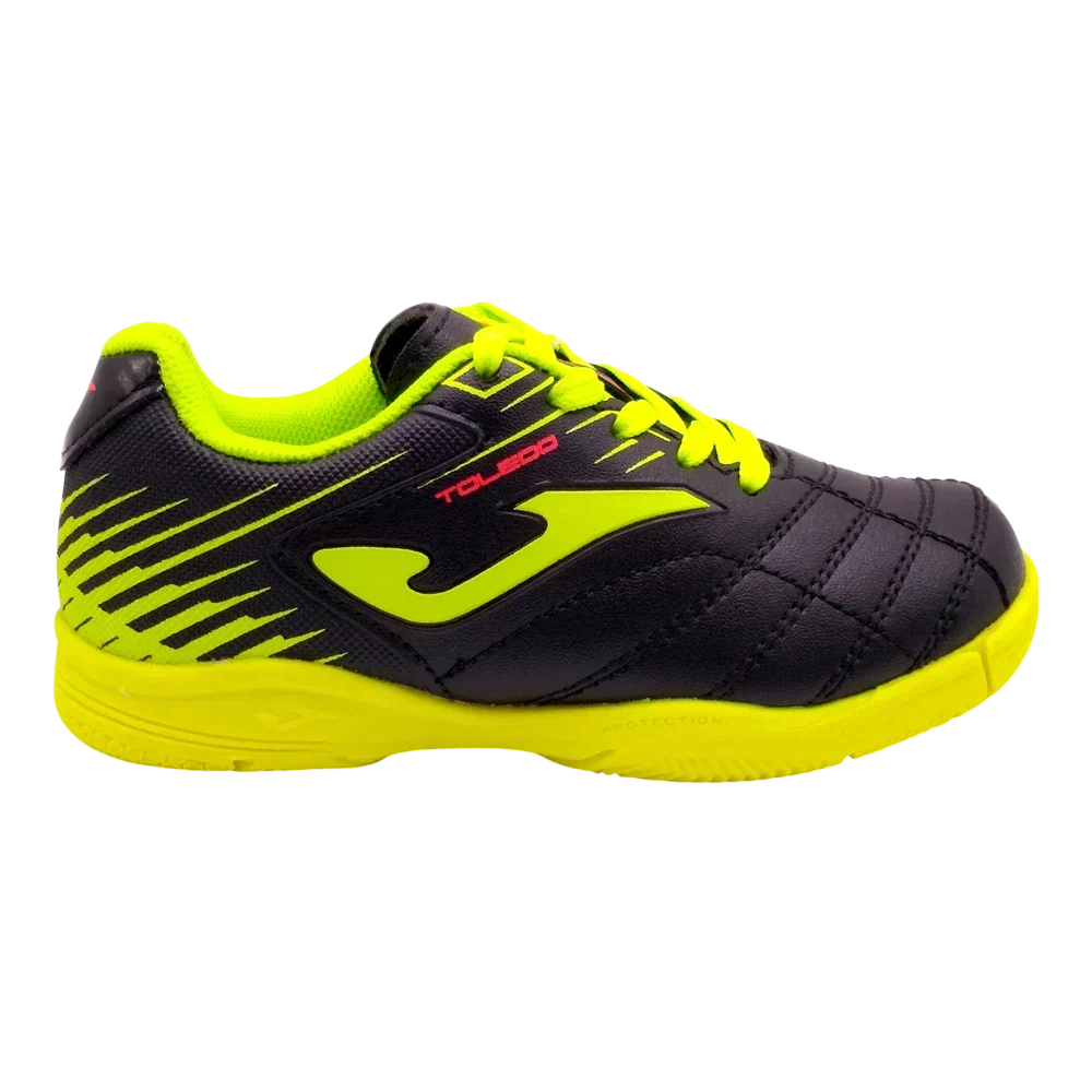 Joma Toledo junior indoor soccer shoe in black synthetic material with neon yellow accents, laces and rubber sole