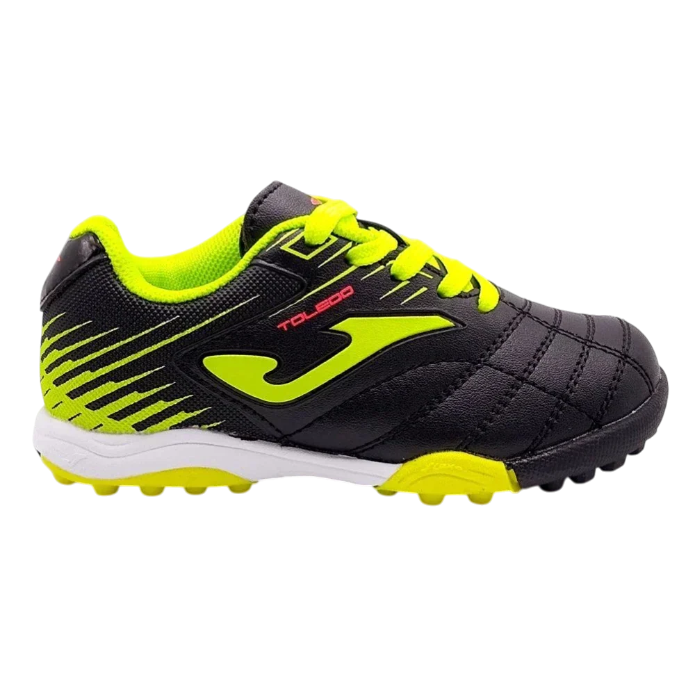 Joma Toledo turf soccer shoe in black with neon yellow laces, logo and rubber studs, plus a white midsole