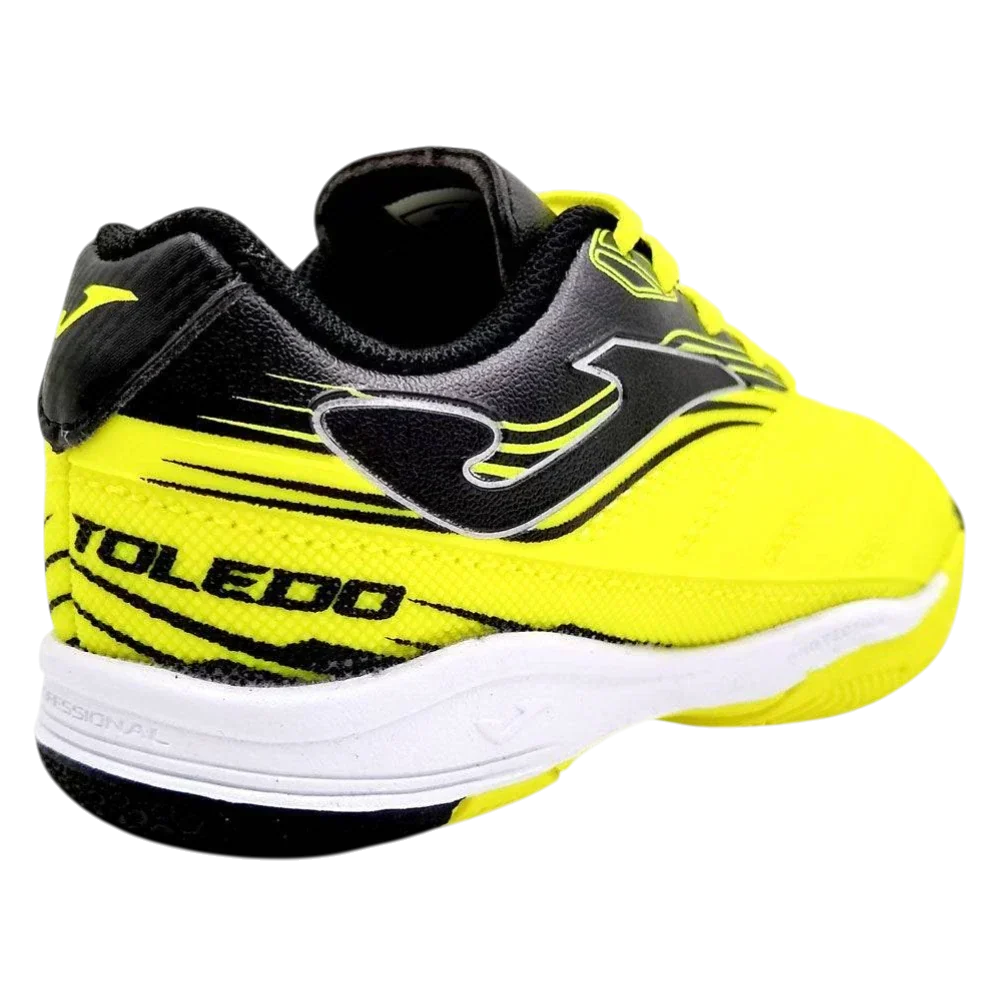 Joma Toledo indoor soccer shoe in neon yellow and black synthetic material, with striped panels and white sole