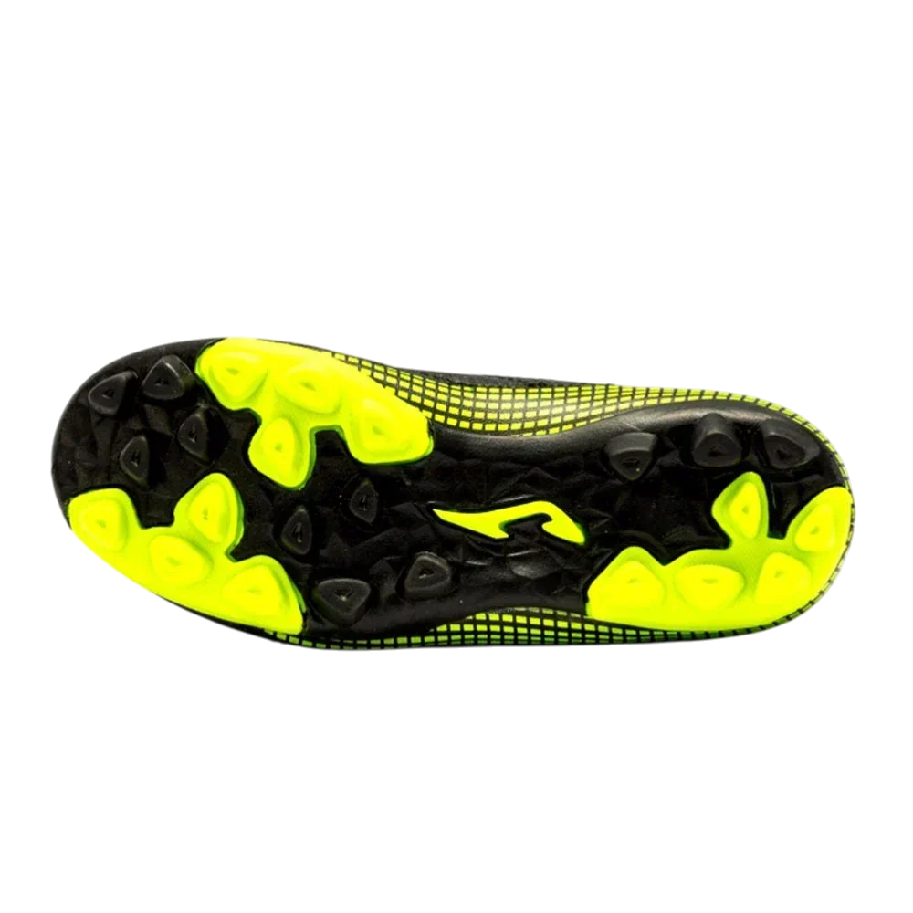 Joma Toledo junior soccer shoe outsole in black with neon yellow molded studs and textured traction zones