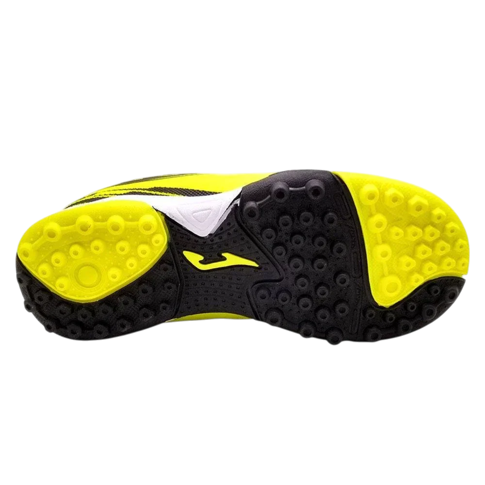 Joma Toledo youth turf soccer shoe sole with black rubber studs, bright yellow traction panels and logo