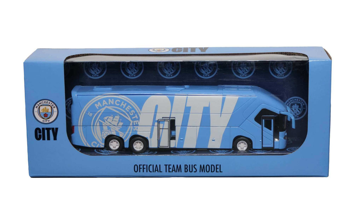 Manchester City Mini Team Bus collectible featuring a blue miniature coach with City branding and white lettering in a display box