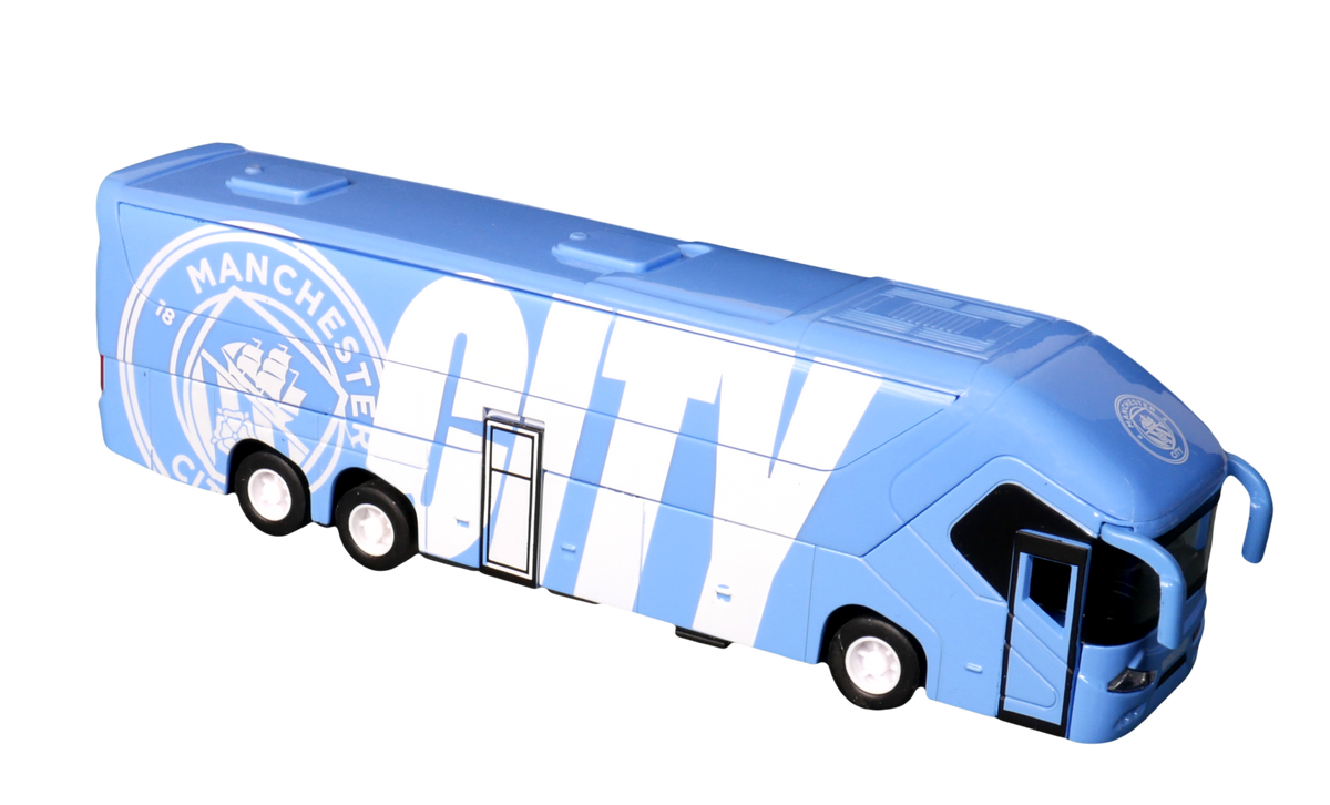 Manchester City Mini Team Bus in sky blue with white club lettering and crest, featuring a miniature coach design