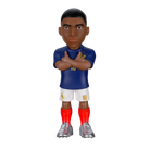 Minix Kylian Mbappé France figurine in a blue jersey, white shorts and red socks, posing with crossed arms