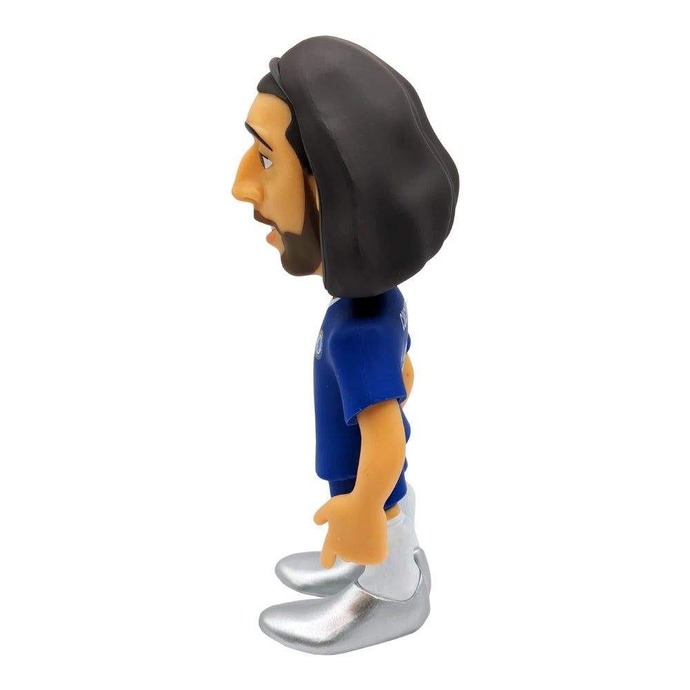 Minix Marc Cucurella Chelsea figurine with long dark hair, blue jersey, white shorts and oversized silver boots