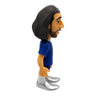 Minix Marc Cucurella Chelsea figurine with long dark hair, beard, blue shirt, and silver shoes