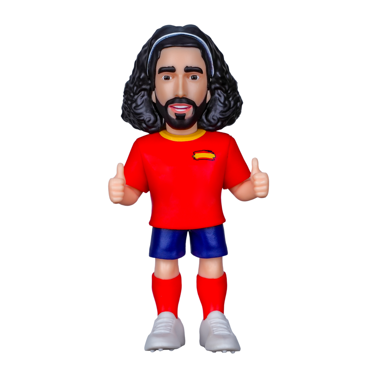 Minix Marc Cucurella collectible figurine with curly dark hair, red Spain shirt, blue shorts and white boots