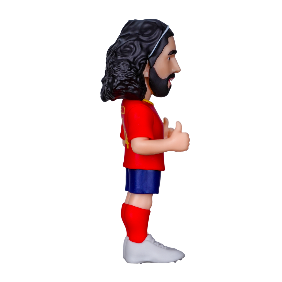 Minix Marc Cucurella Spain football figurine with long curly dark hair, red shirt, blue shorts and white boots