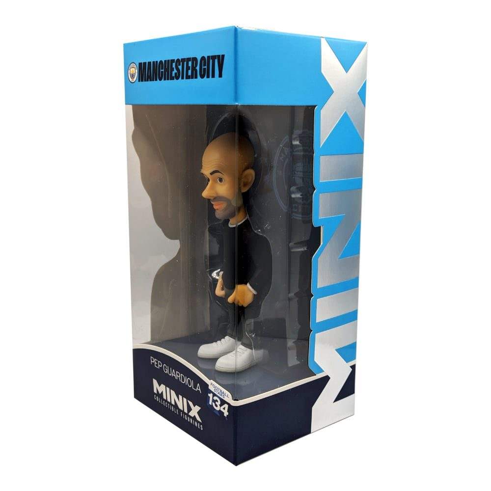 Minix Pep Guardiola Manchester City figurine with bald head, beard, black outfit and white trainers in branded display box