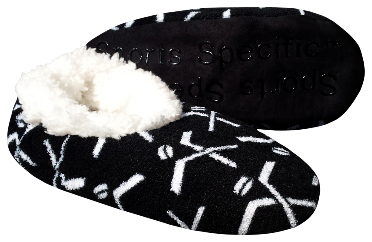 Sport Slippers in black fleece with a white hockey stick and puck pattern, plush white lining and textured sole